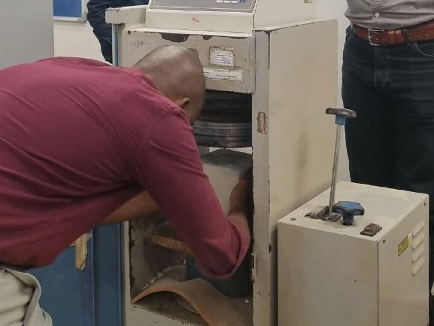 Technician repairing an instrument with the cabinet open